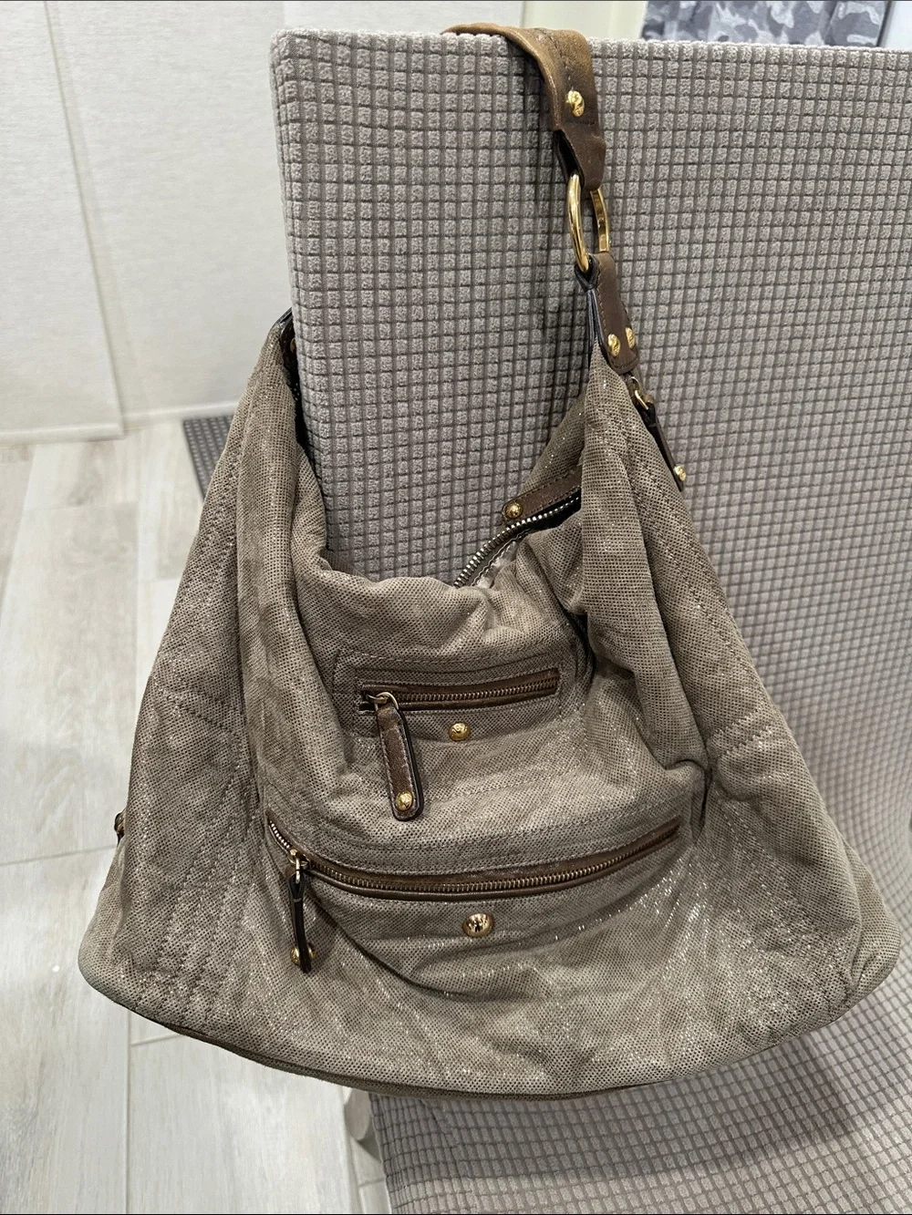 Tod’s Soft Metallic Taupe Hobo Bag with Gold Hardware. Lots of pockets,
